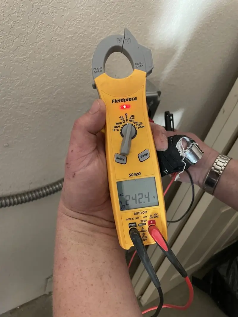 Voltage testing with clamp meter during Electrical Installation Services in Dennis